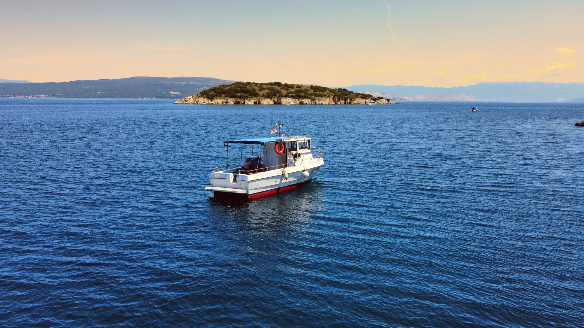 The Nostromo boat cruising open water in the Kvarner bay