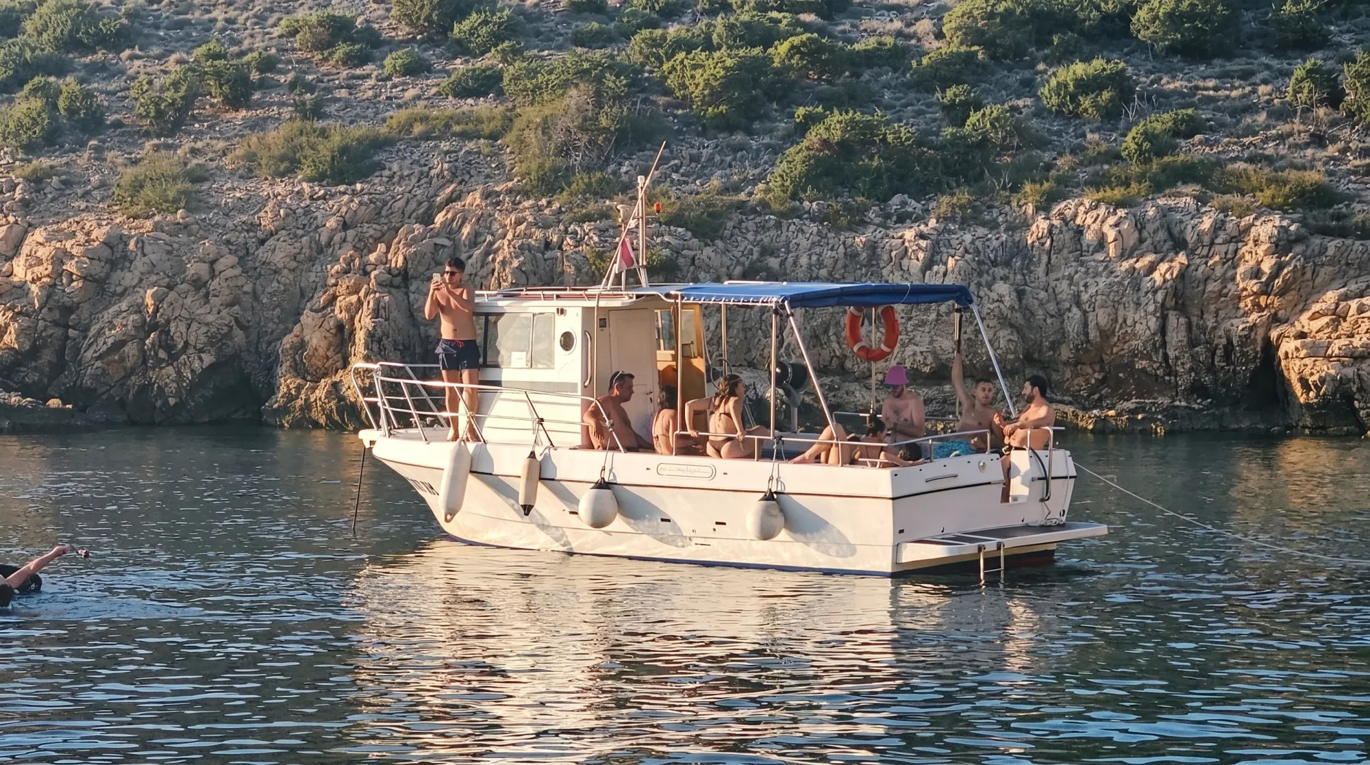 Guests on the open deck during a private boat tour from Krk